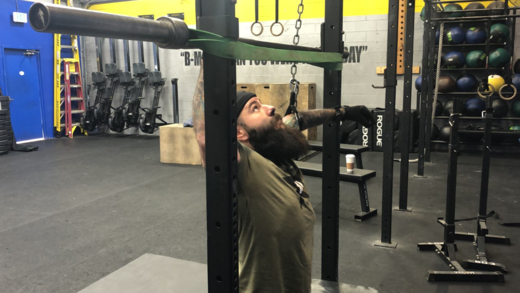 Veteran doing a pull up 